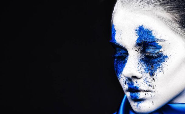 fashion model girl portrait with colorful powder make up. woman with bright blue makeup and white skin. Abstract fantasy make-up - Fotografie, Obrázek