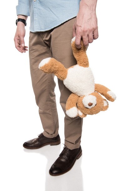 casual man holding teddy bear - Photo, Image