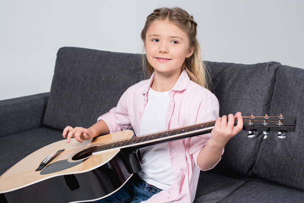 girl practicing to play on guitar  - Photo, Image