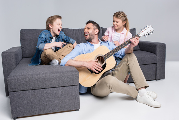 happy family playing on guitar - Fotoğraf, Görsel
