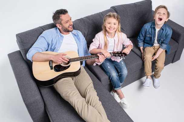 Happy family with guitar  - Valokuva, kuva