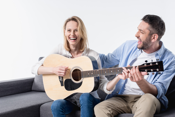 man teaching woman playing guitar - Fotografie, Obrázek