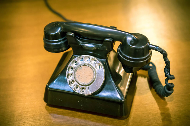 Vintage telephone on wood old table - Photo, Image