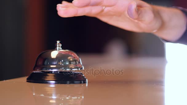 Person call on a old hotel bell on a wood stand and get chip key from hotel room. 4K. - Imágenes, Vídeo