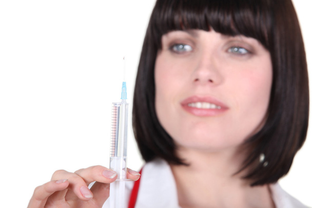 A nurse preparing an injection - Фото, зображення
