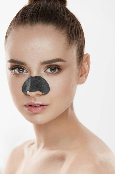 Cosmetology. Beautiful Female With Black Mask On Nose - Fotó, kép