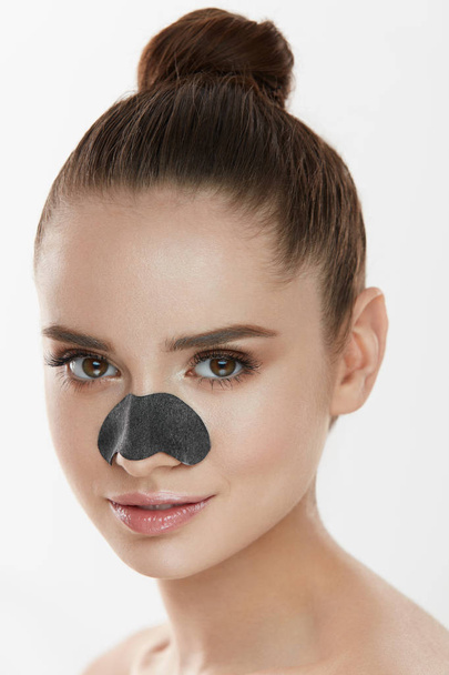 Cosmetology. Beautiful Female With Black Mask On Nose - Fotó, kép