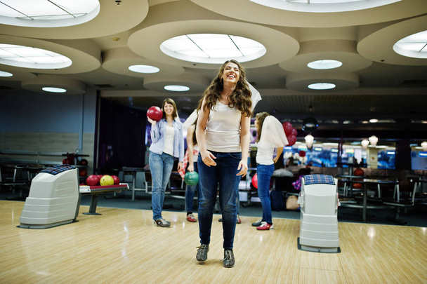 Group of girls having fun and play bowling at hen party. - Foto, Imagen