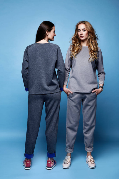 Two beautiful woman sexy clothes casual suit shirt and pants tre - Valokuva, kuva