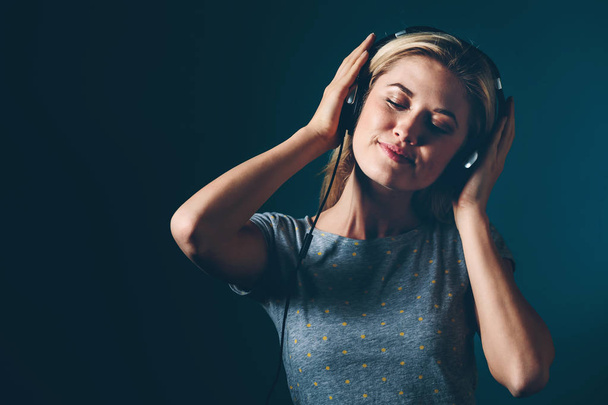 Happy young woman with headphones - Fotografie, Obrázek
