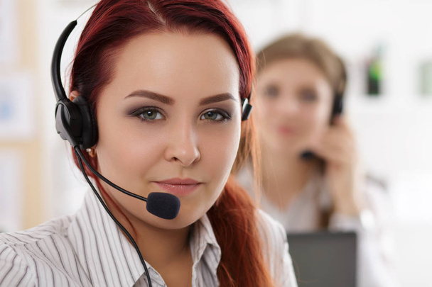 Portrait of call center worker accompanied by her team - Photo, Image