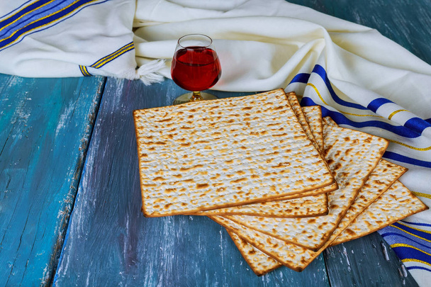 Red kosher wine with a white plate of matzah or matza and a Passover - Photo, Image