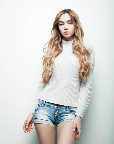 Young fashion model posing in studio - Фото, зображення
