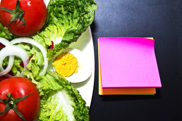 tomato salad and Notepad - Фото, изображение