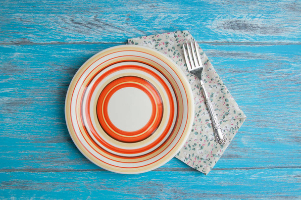 Striped plate on wood background - Foto, immagini