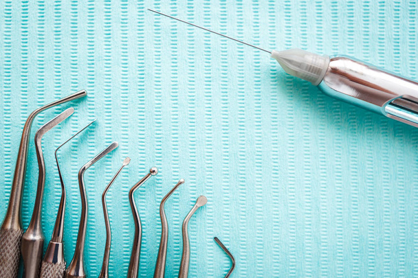 dental instruments on blue napkin. Top view with copy space for text. - Fotografie, Obrázek