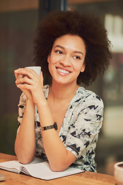 Young mixed raced woman in cafe  - Fotó, kép