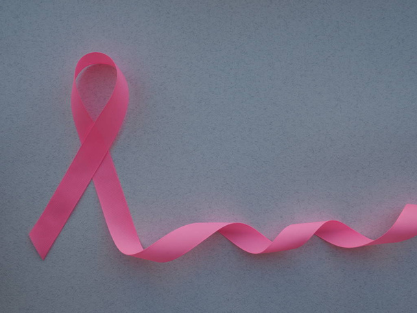 pink ribbon breast cancer on pink background - Foto, Imagen