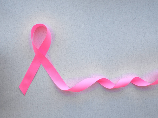 pink ribbon breast cancer on pink background - Photo, Image