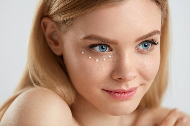 Beauty Cosmetics. Woman With Drops Of Eye Skin Cream On Skin - Fotoğraf, Görsel