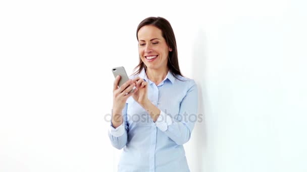 happy businesswoman with smartphone at office - Materiał filmowy, wideo