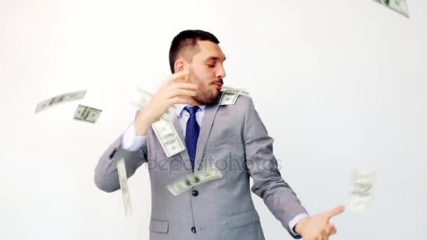 happy businessman with packets of dollar money - Záběry, video