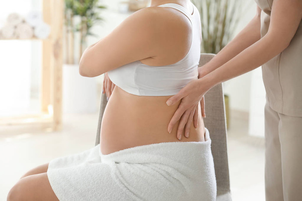 pregnant woman having massage - Foto, Imagen