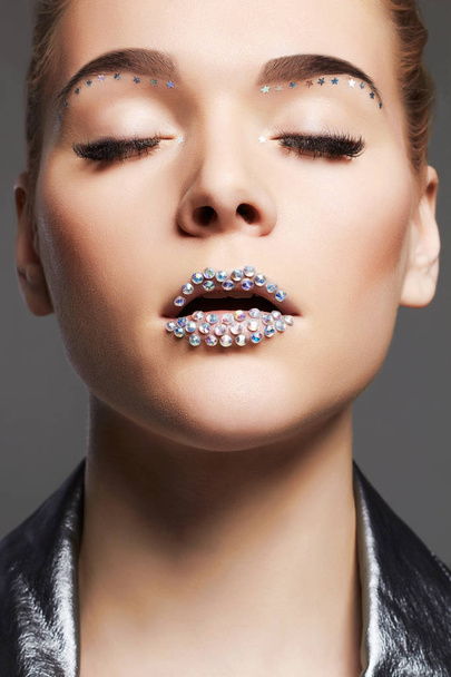 beautiful woman with crystals on lips.beauty make-up - Foto, Imagen