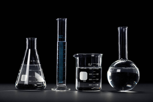 Laboratory Glassware on Dark Background - Foto, afbeelding