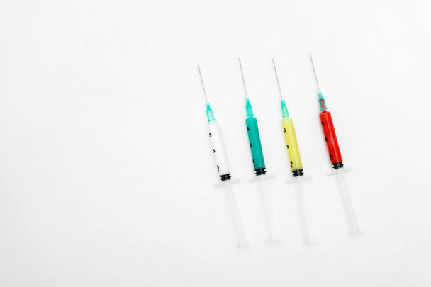 Medical colorful syringes isolated on white background - Fotoğraf, Görsel