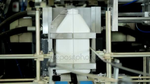 Plastic canister on manufacturing line. Automated production line - Footage, Video