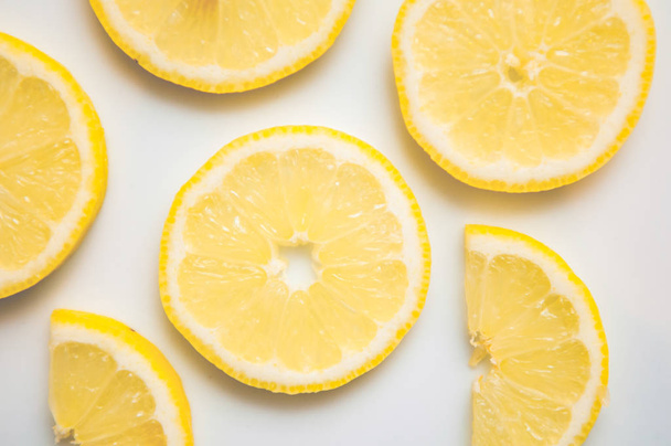 sliced lemon isolated on a white background - Фото, изображение