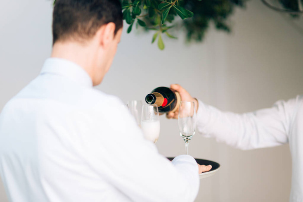 Champagne is poured into glass - Foto, immagini