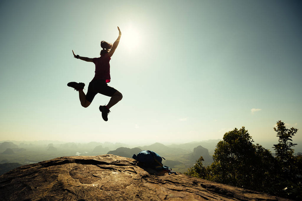 Young woman hiker jumping - Photo, Image