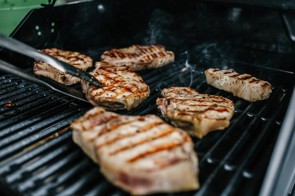 Beef steaks on grill - Фото, зображення