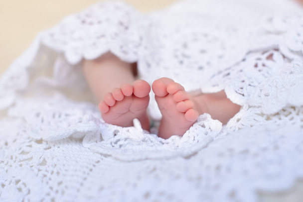 Baby feet close up. Legs of an infant - 写真・画像