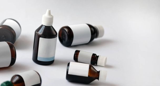 Medications in glass bottles. Medical concept background closeup - Fotó, kép