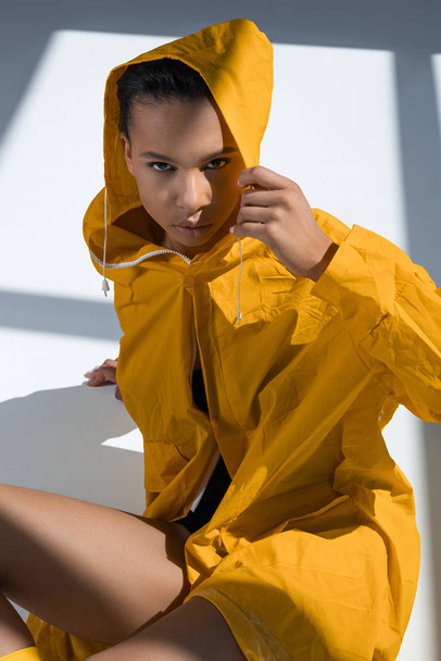 Gorgeous young woman in raincoat  - Fotografie, Obrázek