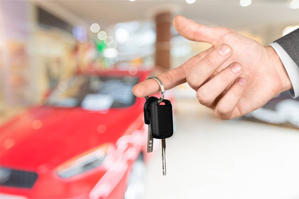 hand with car key and remote - 写真・画像