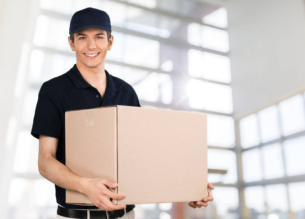 delivery man holding box - Photo, image