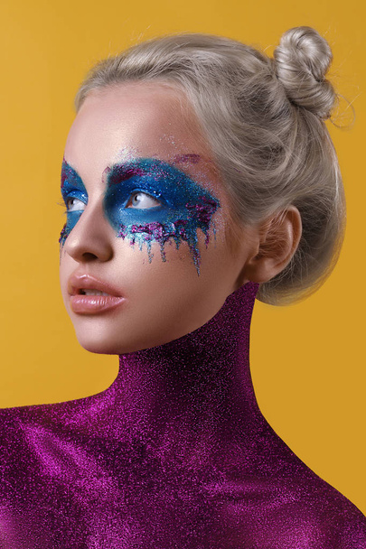 Beautiful portrait of a girl with art make-up and a painted body - Photo, Image