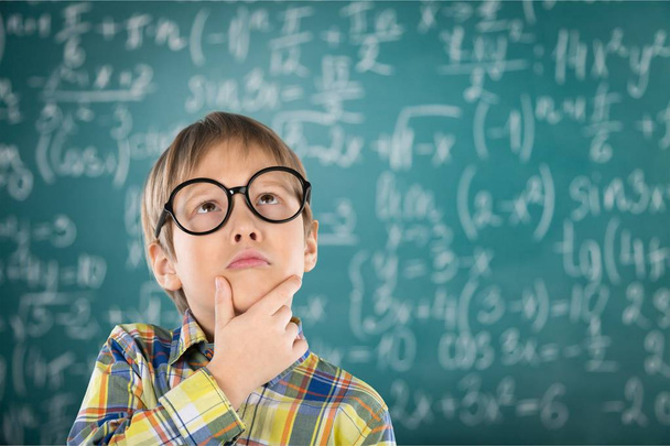 boy in glasses near green blackboard - Фото, зображення