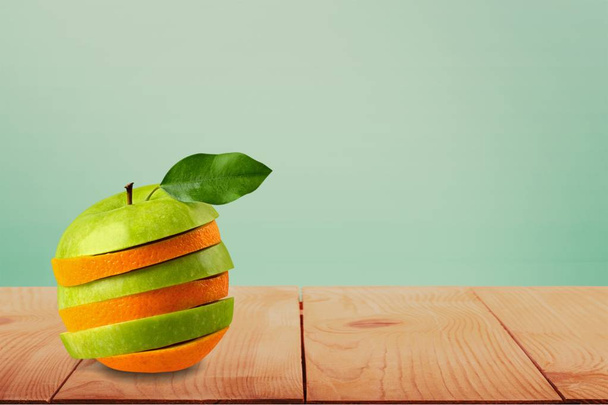 stack of sliced orange and apple - Foto, Imagem