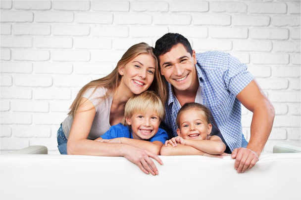 Beautiful smiling family in room  - Fotó, kép