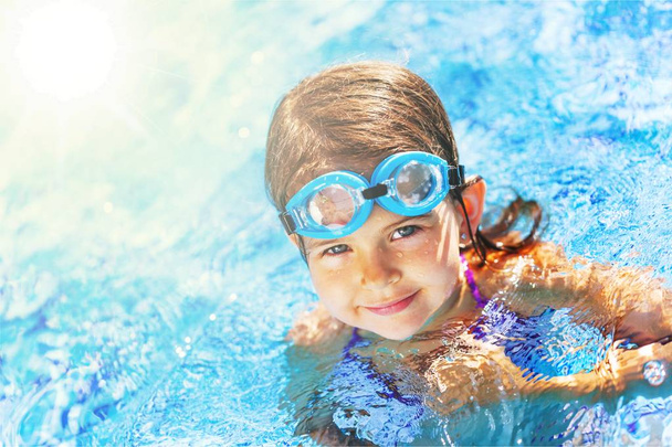 little girl swimming at the pool - Photo, Image