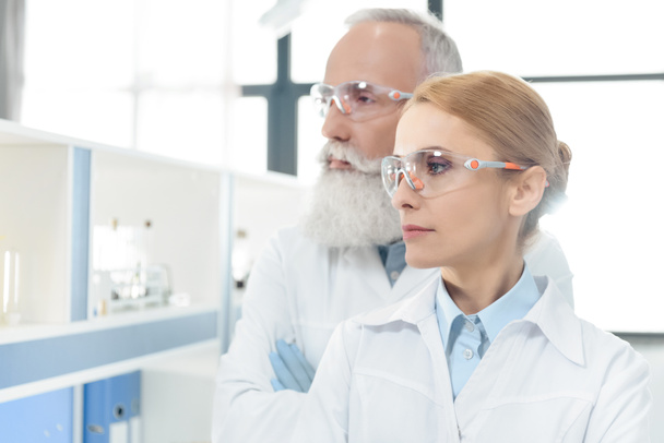 scientists in white coats in lab - Foto, imagen