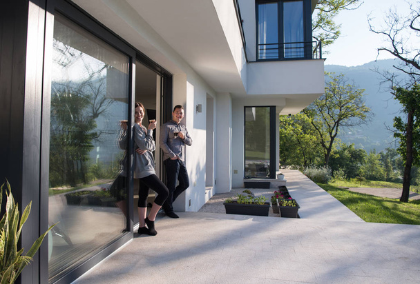 couple enjoying on the door of their luxury home villa - Fotografie, Obrázek