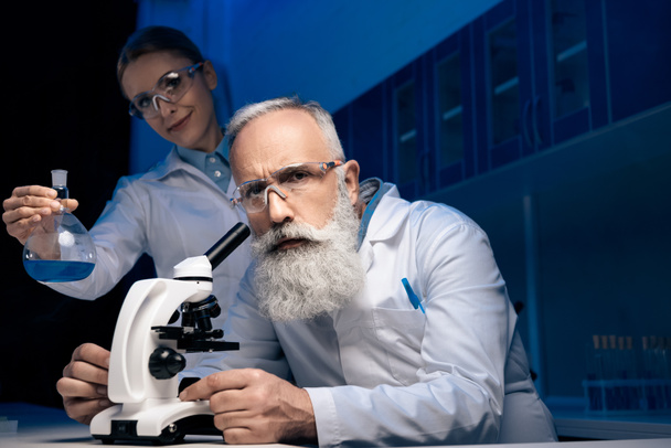 scientists working with reagent - Photo, Image