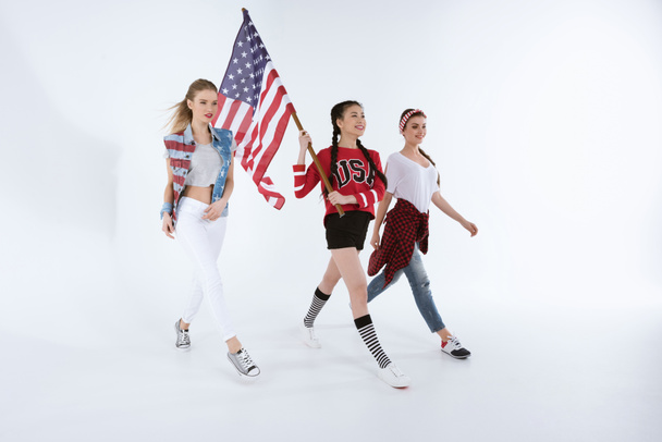 multiethnic girls walking with american flag - Photo, Image