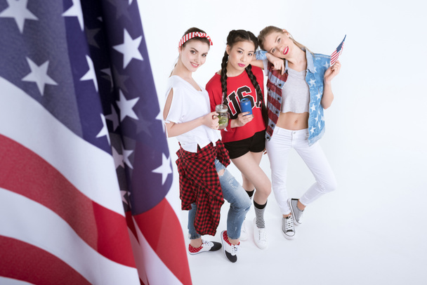 young women with american flag - Фото, зображення